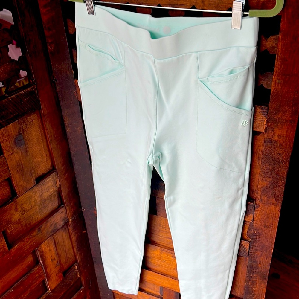 Color is a mint green. These have pockets on the sides like leggings.